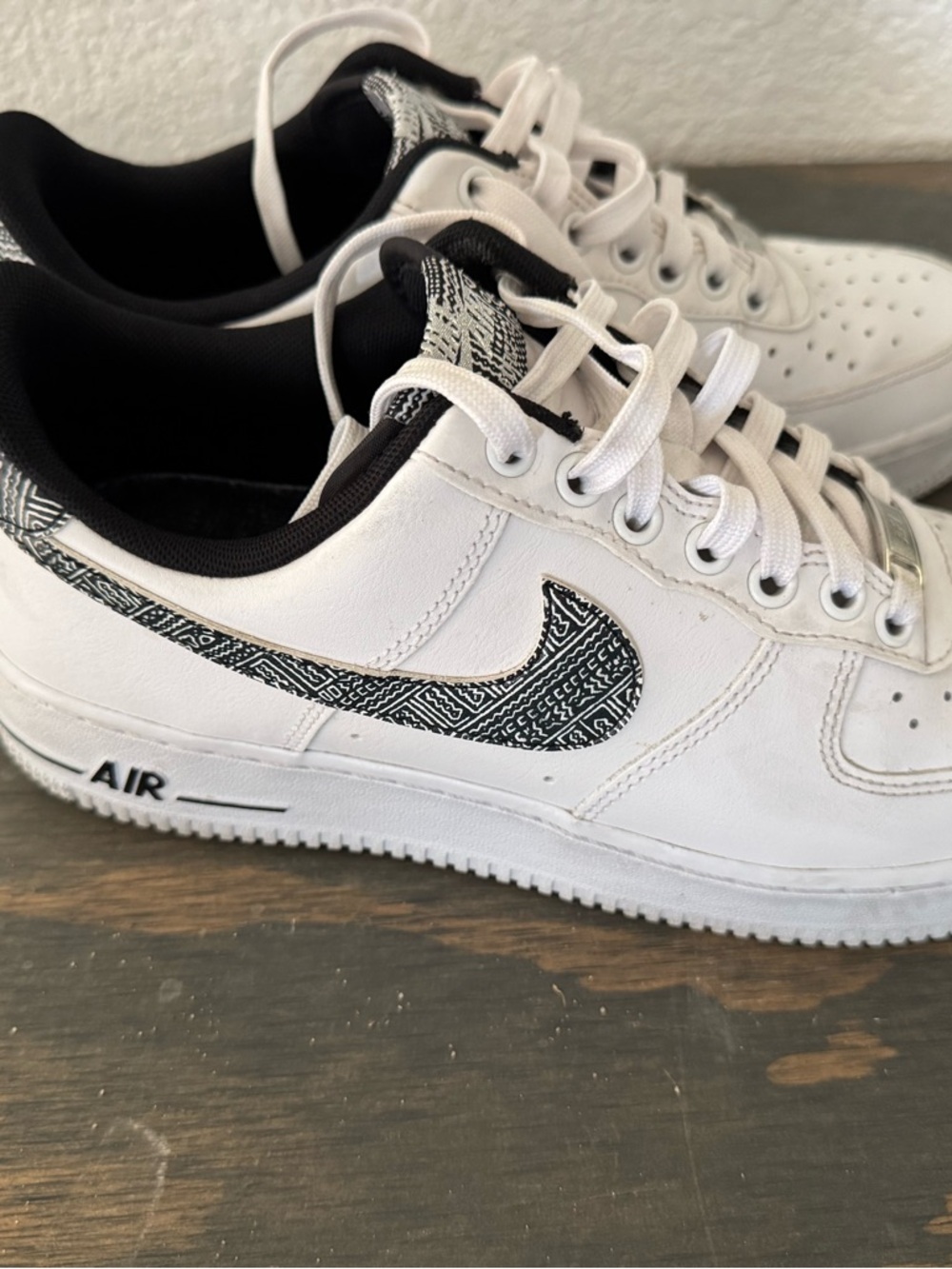 Nike White Sneakers with Black Patterned Swoosh